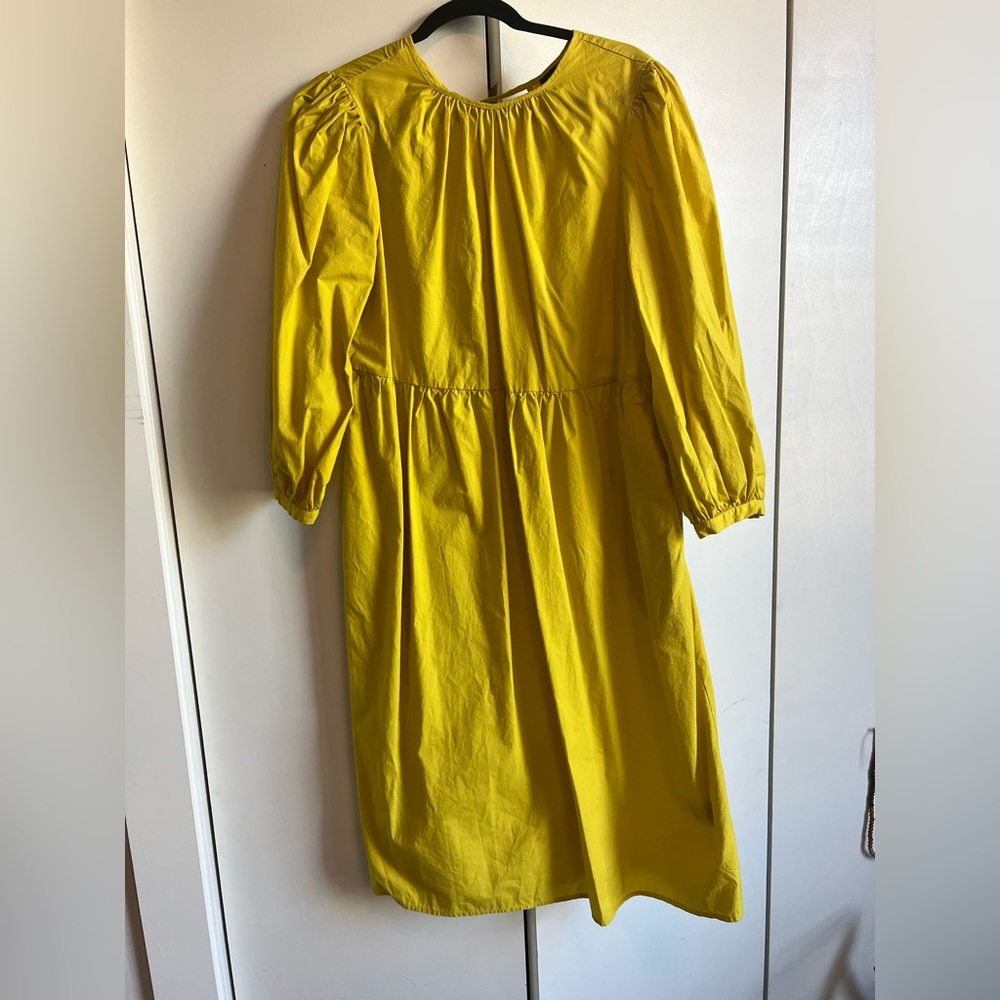 WHO WHAT WEAR Yellow midi dress with open back ties and billow sleeves. Size M